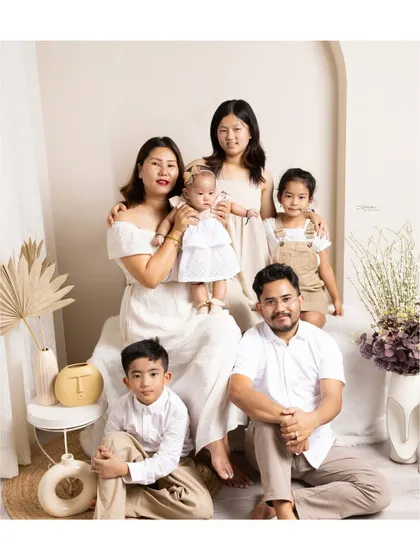 A family is a story of love, and my goal is to capture a beautiful chapter. This portrait showcases the warmth and connection of a multi-generational family, creating a true legacy heirloom.