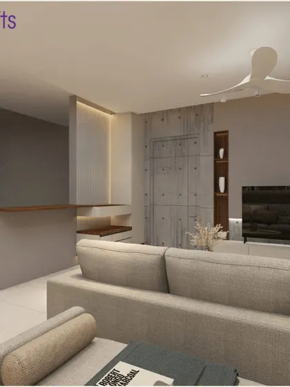 The living room from our 'Konark Splendor' project in Pune. The design is modern and minimalistic, with a neutral sofa and a simple yet effective TV unit against a textured wall.