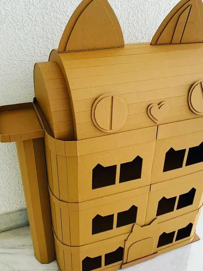 A whimsical cat-themed dollhouse, ready for creative hands. These unpainted structures are perfect for art-based parties or as a special project for your child, encouraging both creativity and imaginative play.