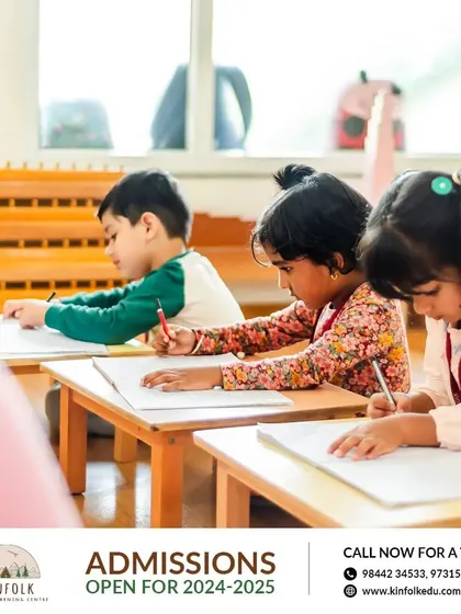 Children focused on their writing practice. Our program prepares children for academic readiness in a gentle, self-paced manner. Admissions are open for 2024-2025.