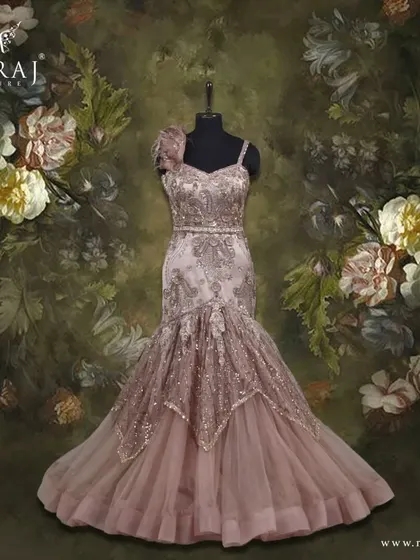 Shine bright in this beautifully patterned dusty coffee brown mermaid gown, finished with stunning copper embellishments.