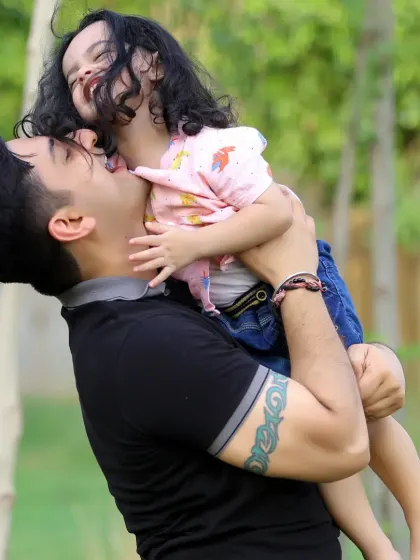The special bond between a father and his child, captured in a beautiful, natural setting.