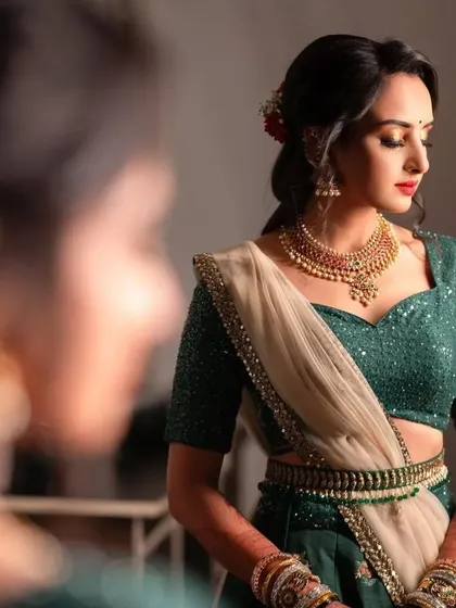 A quiet, reflective moment for the bride during her pre-wedding festivities. The makeup is soft and timeless.