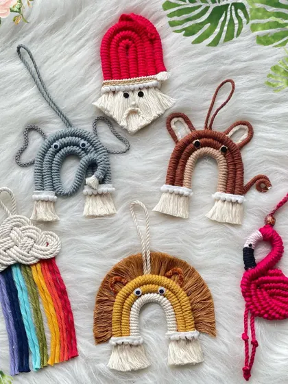 A collection of some of my cutest mini hangings. This set includes a Santa, an elephant, a bear, a rainbow cloud, a lion, and a flamingo, showcasing the variety of characters I can create.