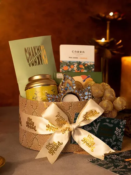 Our round gift box filled with a curated selection of Diwali treats. The elegant packaging and thoughtful contents make it an ideal choice for corporate festive gifting.