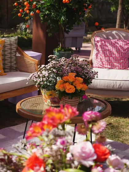 A close-up of the floral arrangements, showing the mix of oranges, pinks, and whites that brought so much life to the garden space.