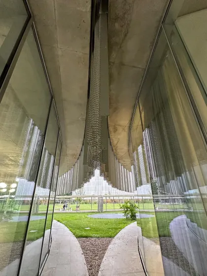 An interior view of the expanded metal skin at Bocconi University, filtering light and views in a delicate way.