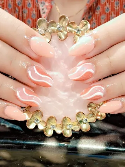 A peachy ombre set with abstract white waves for a modern and artistic design.