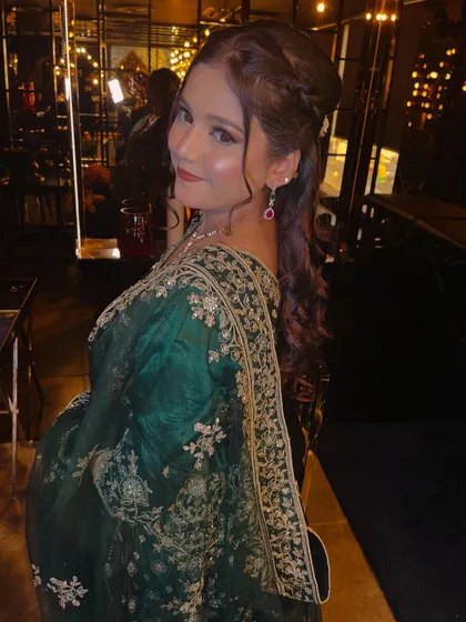 This three-quarter view captures the elegance of the overall look. The model's pose is graceful, and the makeup looks flawless from every angle, highlighting a radiant and youthful glow.