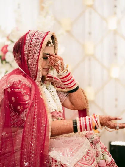 An emotional moment for the bride during the wedding ceremony, a tear of joy and sentiment.