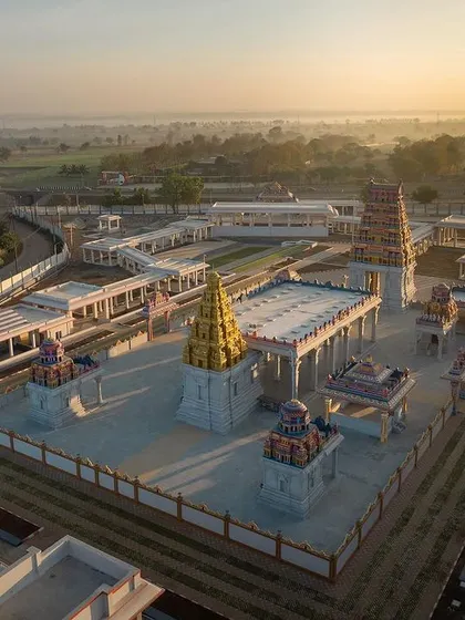 The golden vimana of the main Shiva shrine glows in the morning sun, serving as the spiritual focal point of the entire master plan.