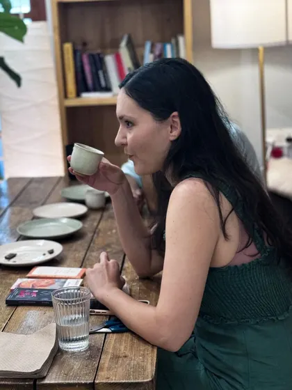 A participant savoring the complex flavors of a coffee and chocolate pairing. These workshops are a great way to refine your palate.