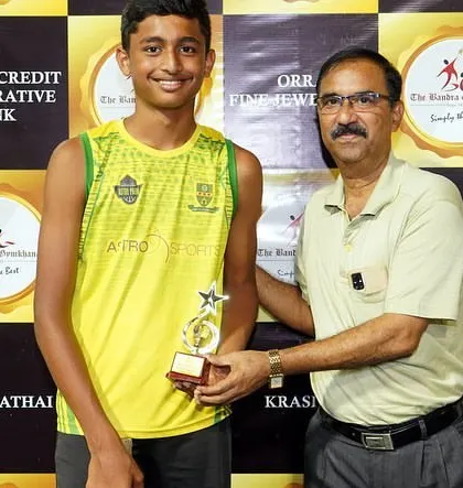 Jordan receiving the Best Player trophy at the Willingdon Catholic Gymkhana tournament.