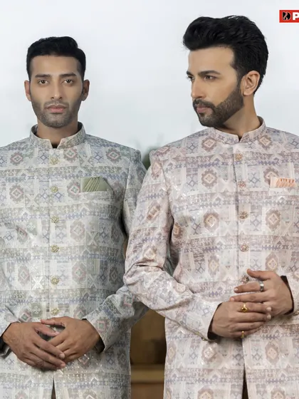 Here you can see two variations of my printed Jodhpuri jackets, one in a lighter tone and one with warmer accents. This shows how the same style can create different moods, perfect for a groom and groomsman duo.