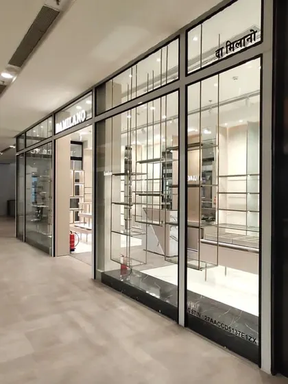 The sleek and minimalist facade of the Da Milano store in Jio World Mall, Mumbai, featuring a modern glass and metal design.