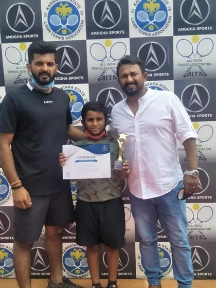 Our student Sanjay Girish with his coaches after winning the ASTA MJW U10 Green Dot Tennis Tournament. We provide comprehensive support, from training to tournament success.