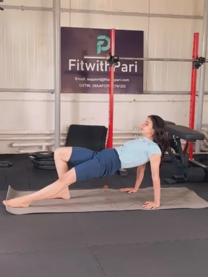 A tabletop bridge with a leg extension. This move strengthens the glutes and hamstrings while opening up the chest and shoulders.