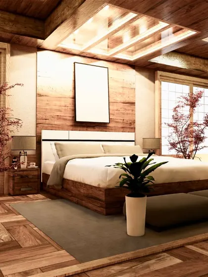 A Japanese-inspired bedroom design that uses natural wood textures on the floor, walls, and ceiling to create a warm and tranquil retreat. The low-profile bed and large windows enhance the feeling of serenity and connection to nature.