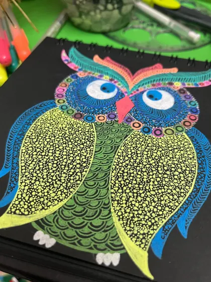 Another angle of the vibrant owl doodle.