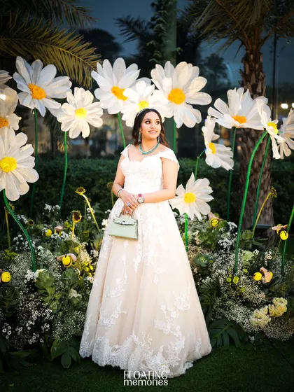 The beautiful mother-to-be, posing in our whimsical field of giant handmade daisies. This photo spot was designed to be both interactive and incredibly picturesque, creating lasting memories.