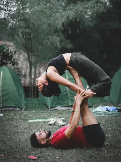 This beautiful assisted backbend is the reason for that smile on my face. Flying in acro yoga is a feeling of complete trust and surrender.