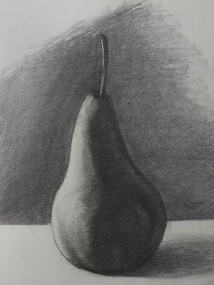 A simple still life drawing of a pear. Practicing with everyday objects is the best way to get good at seeing and drawing light, shadow, and form. It's a fundamental exercise for any artist.