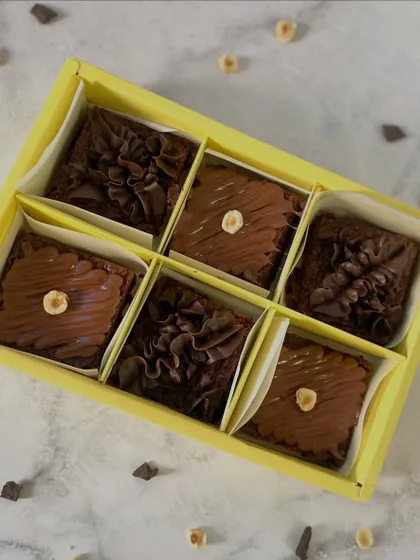 A box of six assorted eggless brownies, showcasing our hazelnut and chocolate fudge varieties. The perfect duo for any chocolate and nut lover.