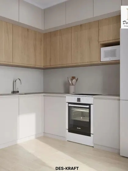This angle showcases the L-shaped layout of the kitchen, with integrated appliances like the oven and microwave, ensuring a seamless and uncluttered look.