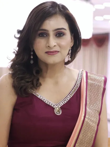 A close up of Manisha's reception makeup, featuring a soft smokey eye and a natural lip color that enhances her features beautifully.