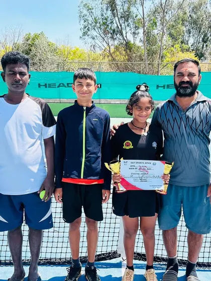 Eshitha with her coach and trophies after winning the double crown at the TS-7 U/14.