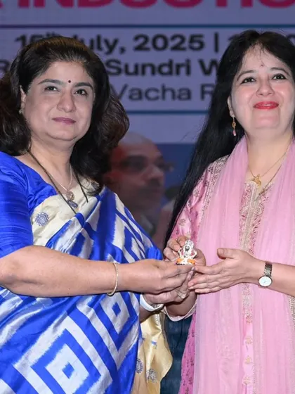 A moment of joy as I receive a small idol of Ganesha along with the honor from the university.