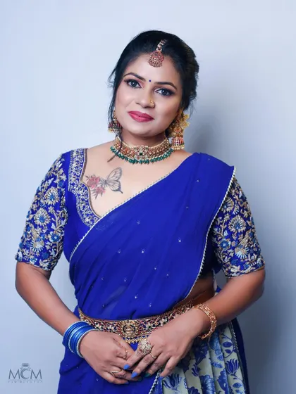 Another view of the royal blue embroidered blouse, showing how it fits perfectly and complements the client's look for her special occasion.