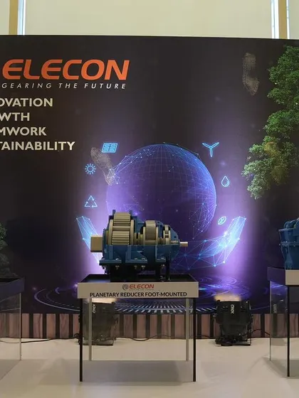 A dedicated product display area for the Elecon launch event. The branded backdrop and clean, modern pedestals ensure the new gearboxes are the heroes of the space, allowing for detailed viewing and photography.