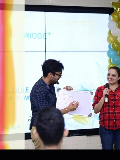 Writing down a prediction with a volunteer on stage. The anticipation in these moments is electric.