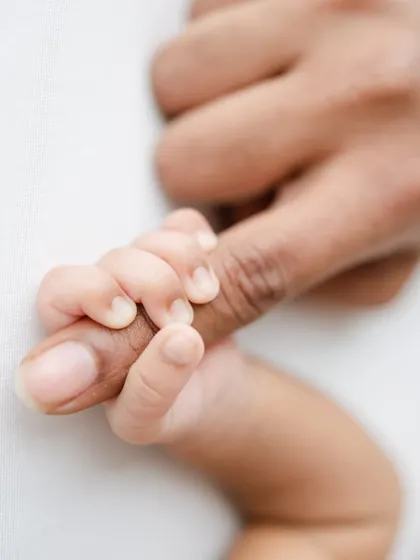 It's all about the tiny details. A baby's grip is one of those fleeting reflexes that we love to capture, a beautiful symbol of the instant bond between a parent and their child.