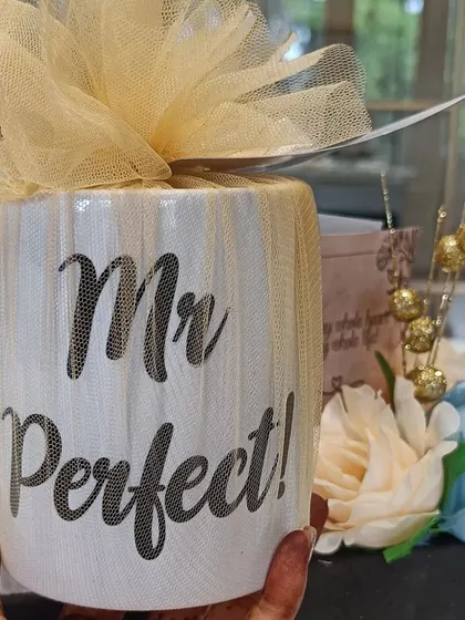 A 'Mr. Perfect' mug, wrapped in tulle, ready to be included in an engagement or anniversary hamper for a special man.
