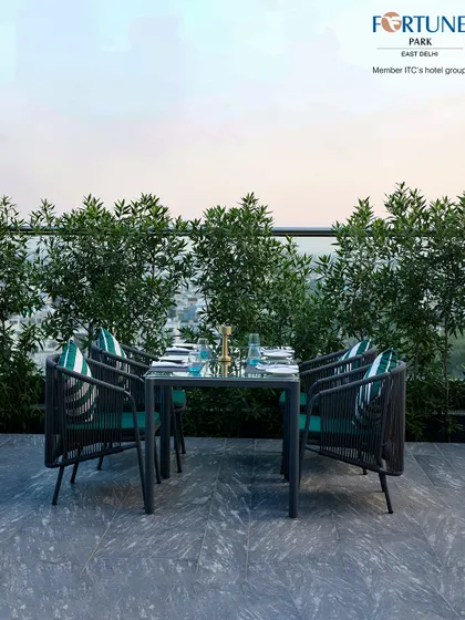 A beautifully set table at Nakshatra, ready for guests to enjoy a meal against the backdrop of the city.