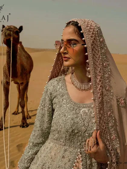 Sparkle like a diva in this ravishing pastel pink-peach-grey Indo-Western attire, reflecting beautiful self-oxidized zardosi work.