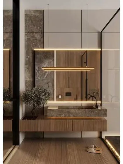 A luxurious bathroom design with floor-to-ceiling marble and wood paneling. The floating vanity with an integrated stone sink and modern pendant lighting creates a sophisticated and high-end feel.