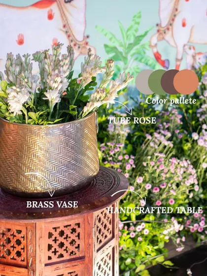 A breakdown of a decor setup, showing how a brass vase, tuberose flowers, and a handcrafted table come together. We thoughtfully select each element to match the color palette and overall theme.