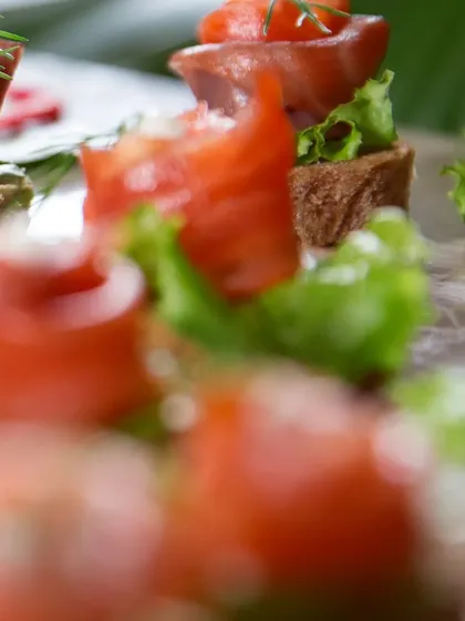 Another angle of my smoked salmon bites, showcasing the fresh lettuce and creamy topping that complete this perfect canapé.