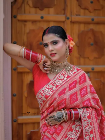A classic portrait pose against the wooden door. The direct gaze and confident posture make this a strong and captivating shot.