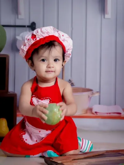 A recipe for happiness: a pinch of joy, a scoop of laughter, and a whole lot of love from our tiny chef.