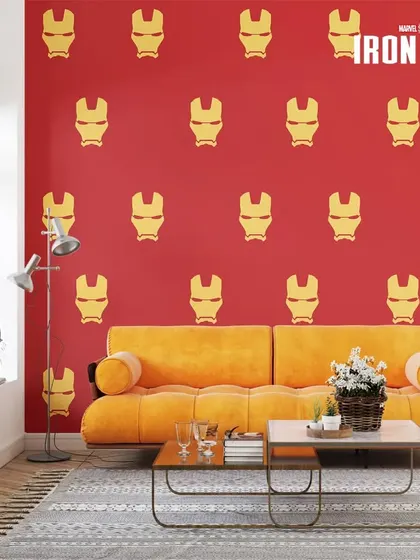 A repeating pattern of Iron Man's helmet in gold on a red wall creates a vibrant and unmistakable tribute to the Avenger.