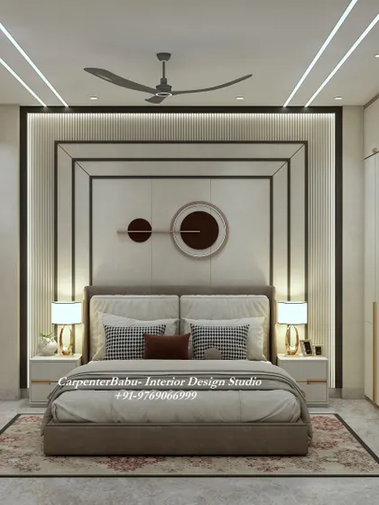 The headboard wall in this guest room is a statement in itself, with a geometric design and modern circular art. The design is sophisticated and welcoming.