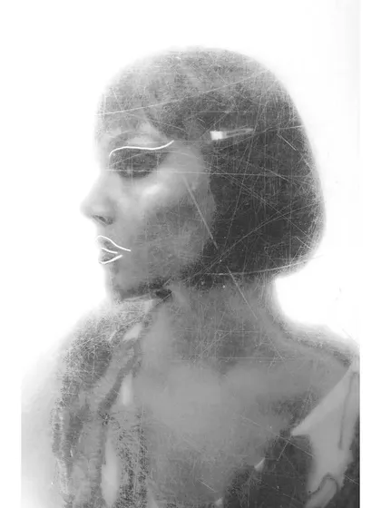 An experimental, multi-layered portrait. The scratched texture and graphic white lines drawn on the lips and eyes add an artistic, edgy layer to a classic black and white beauty shot.