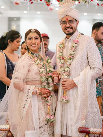 Another beautiful shot of the couple at their ceremony. Their coordinated outfits and happy smiles make for a picture-perfect memory.