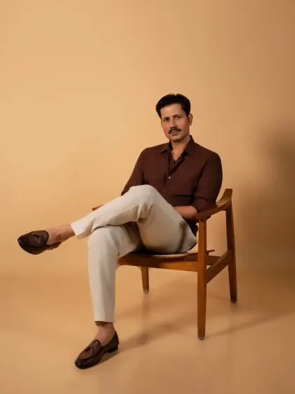 A full-length portrait of Sumeet Vyas against a neutral backdrop. This classic composition highlights his relaxed posture and the clean styling of the shoot, making it a strong image for any actor's portfolio.