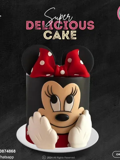 This striking Minnie Mouse cake features her iconic silhouette against a bold black background. The large, 3D face and classic red polka-dot bow make it a chic and instantly recognizable design.