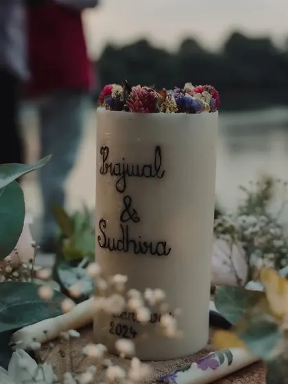 A symbol of their union. For their vow ceremony, we created this beautiful, personalized candle etched with the couple's names, which they lit together to mark the start of their new journey.